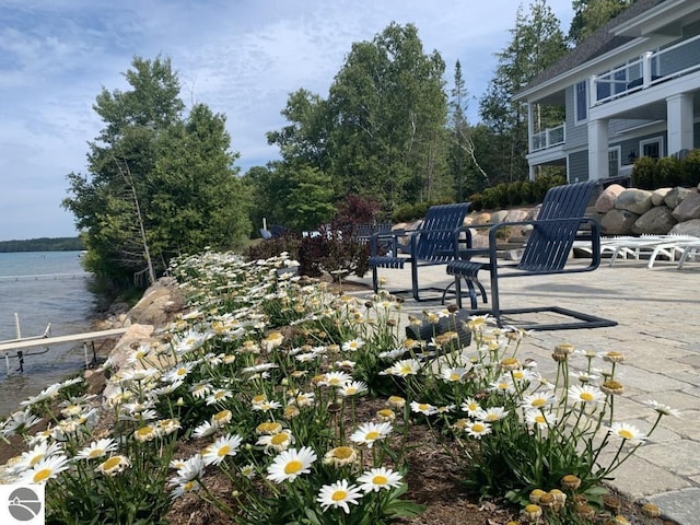 exterior space featuring a patio and a water view