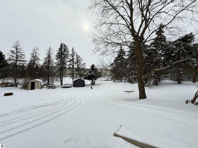 view of yard layered in snow