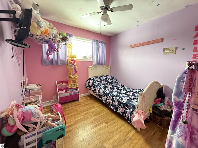 bedroom featuring ceiling fan and light wood-type flooring