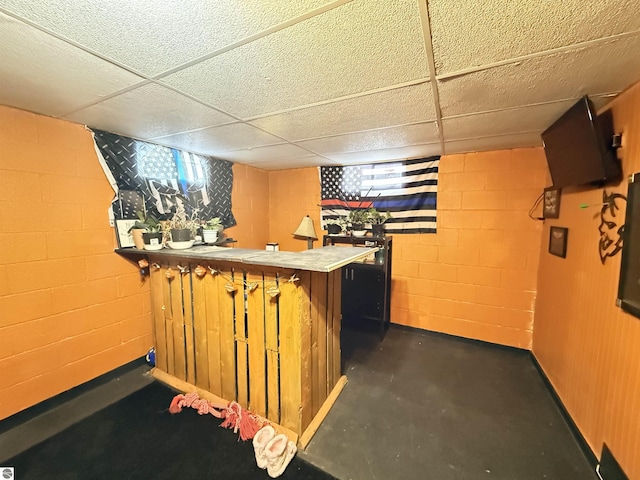 bar featuring a paneled ceiling