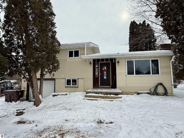 split level home featuring a garage