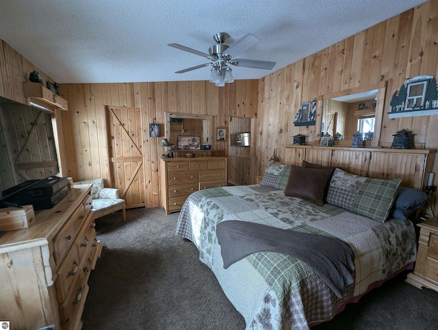 carpeted bedroom with a textured ceiling and wood walls