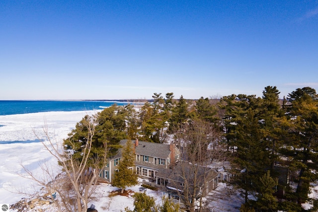 exterior space featuring a view of the beach and a water view