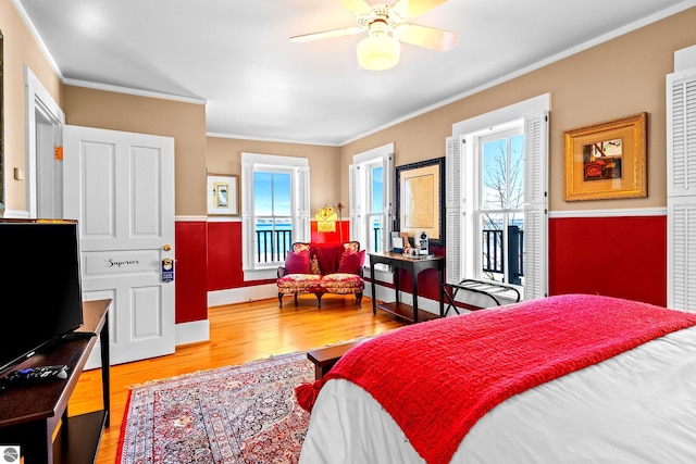 bedroom featuring hardwood / wood-style floors and ornamental molding