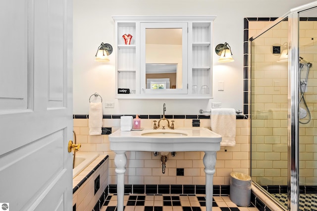 bathroom featuring tile patterned floors, independent shower and bath, and sink