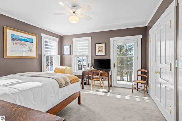 carpeted bedroom with a ceiling fan, ornamental molding, and access to exterior