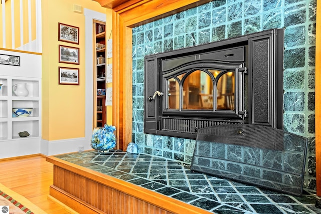 room details with built in shelves and wood-type flooring