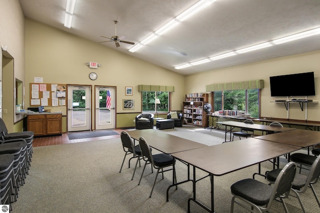 office with high vaulted ceiling, carpet flooring, and a wealth of natural light