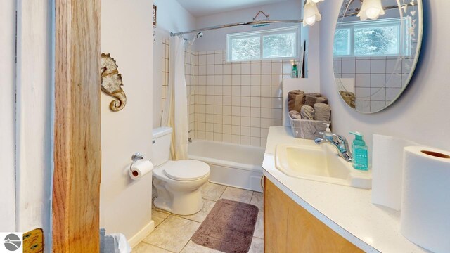 bathroom featuring shower / tub combo, toilet, tile patterned flooring, and vanity