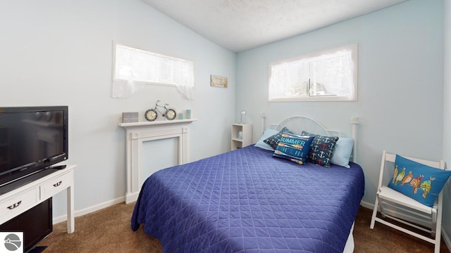 carpeted bedroom featuring baseboards and vaulted ceiling