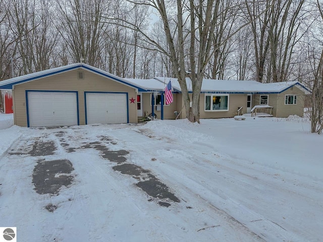 ranch-style house featuring a garage