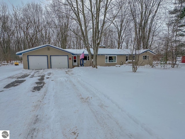 single story home featuring a garage