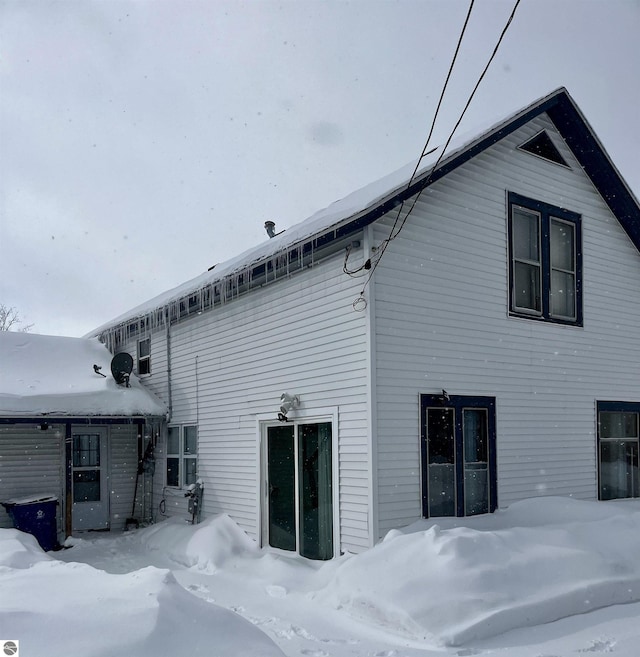 view of snow covered house