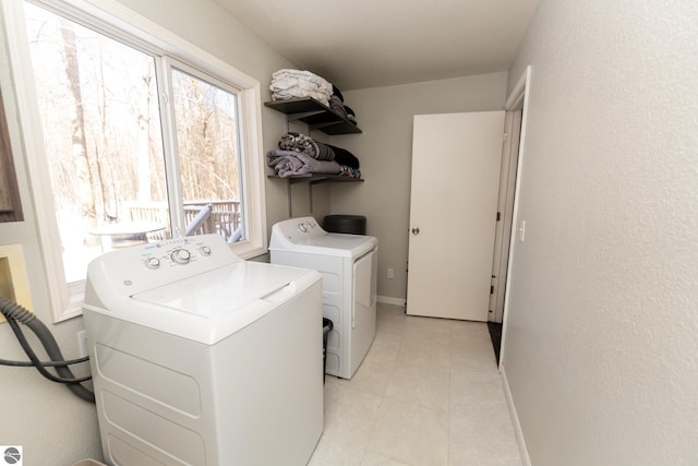 clothes washing area with independent washer and dryer