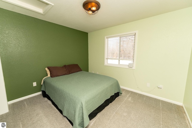 bedroom featuring light carpet