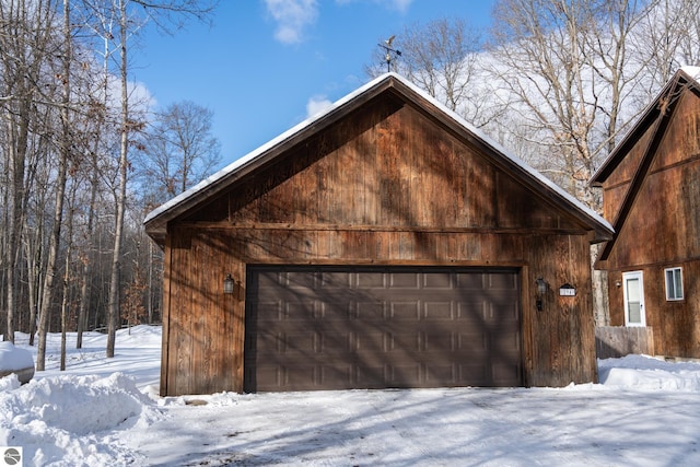 view of snow covered garage