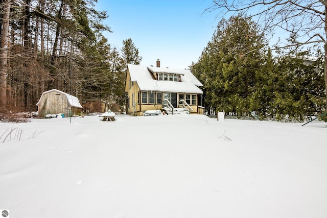 view of snow covered house