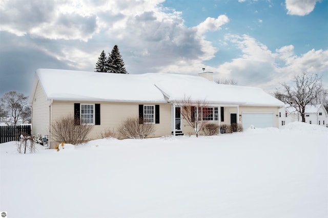 ranch-style home featuring a garage