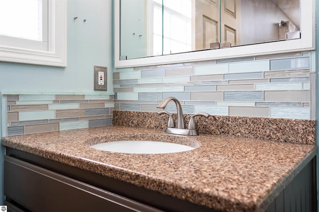 details featuring backsplash and vanity