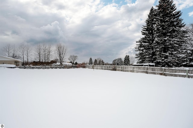 view of yard layered in snow