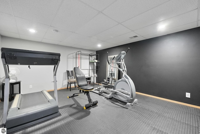 exercise area featuring a paneled ceiling