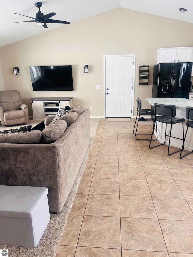 tiled living room with vaulted ceiling and ceiling fan