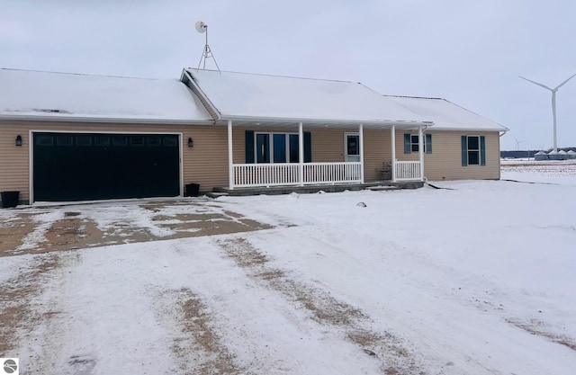 view of front of property with a garage and a porch