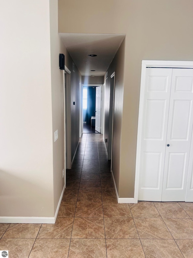 hall featuring tile patterned flooring