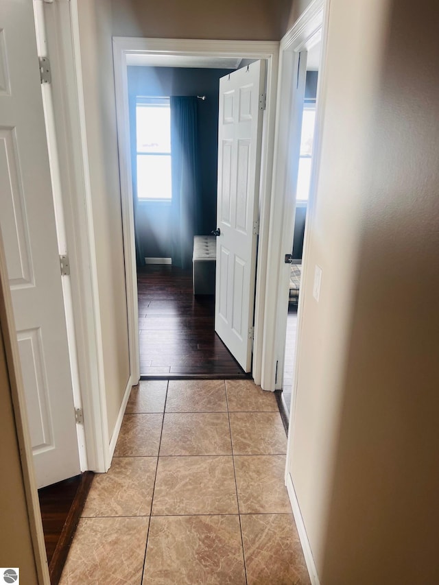 hallway with light tile patterned floors