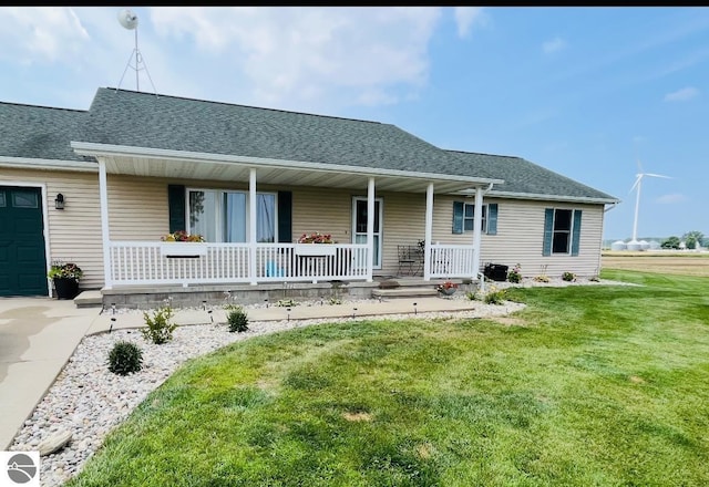 view of front of house featuring a front yard and a porch