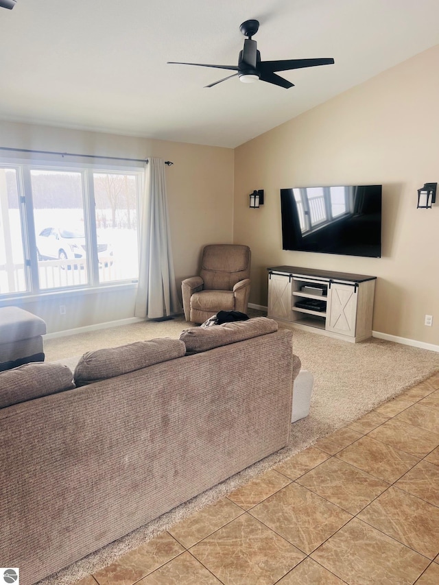 tiled living room with vaulted ceiling and ceiling fan