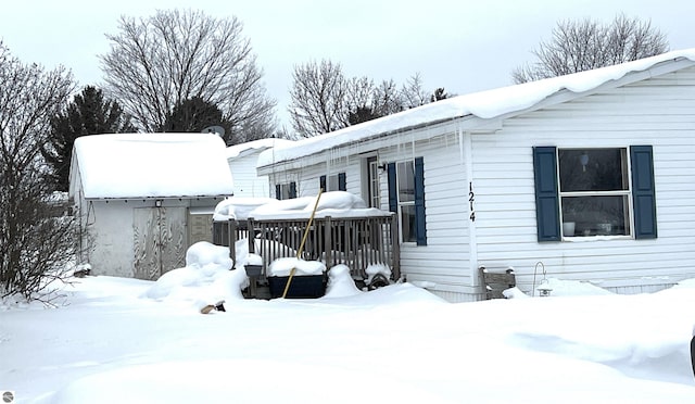 view of snow covered house