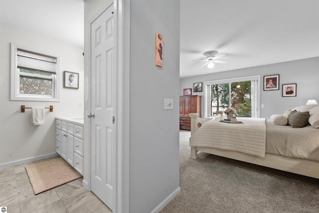 bedroom featuring ceiling fan and light colored carpet