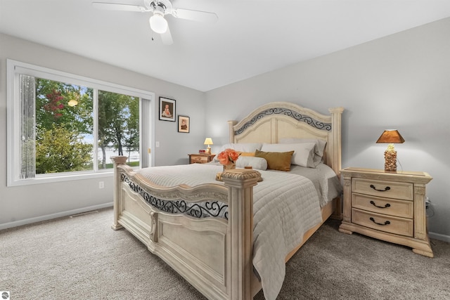 bedroom with dark carpet and ceiling fan