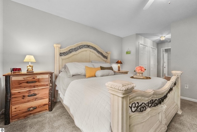 bedroom featuring light carpet, ceiling fan, and a closet