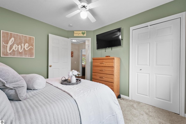 carpeted bedroom with ceiling fan