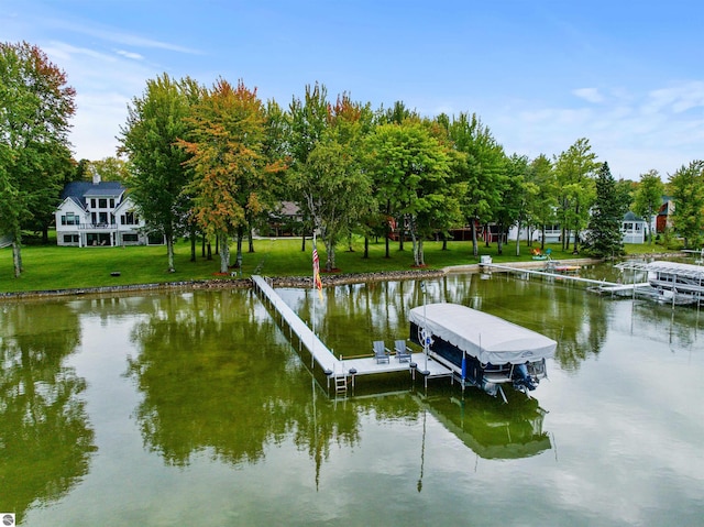 dock area featuring a yard and a water view