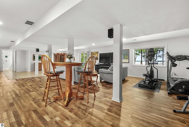 interior space with plenty of natural light and wood-type flooring