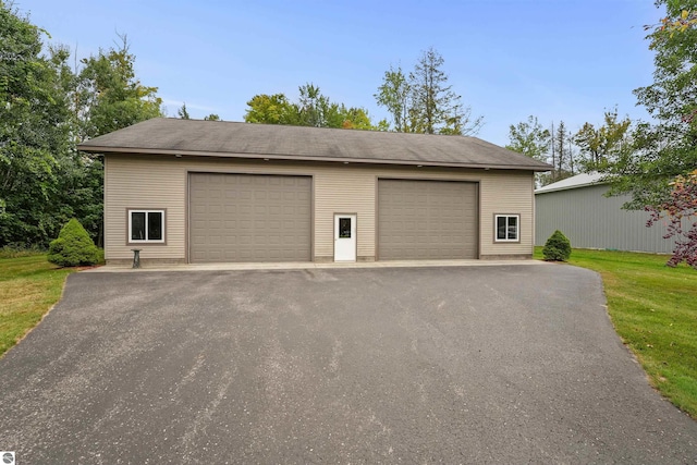 garage with a lawn