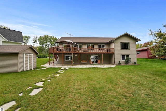 back of house featuring a patio area, a yard, a shed, and a deck