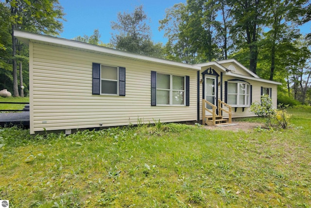 4551 Tulick Dr, Boon, MI 49618 - view of front of house featuring a front lawn