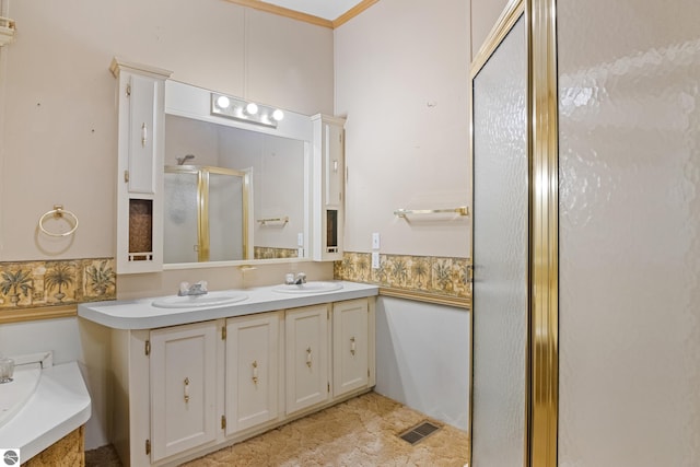 bathroom with crown molding, plus walk in shower, and vanity