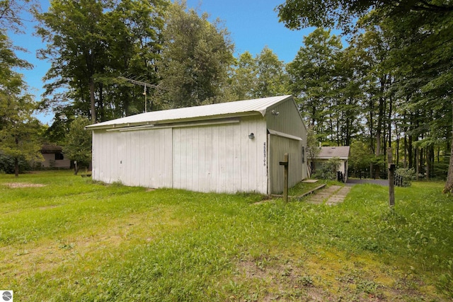 garage featuring a yard