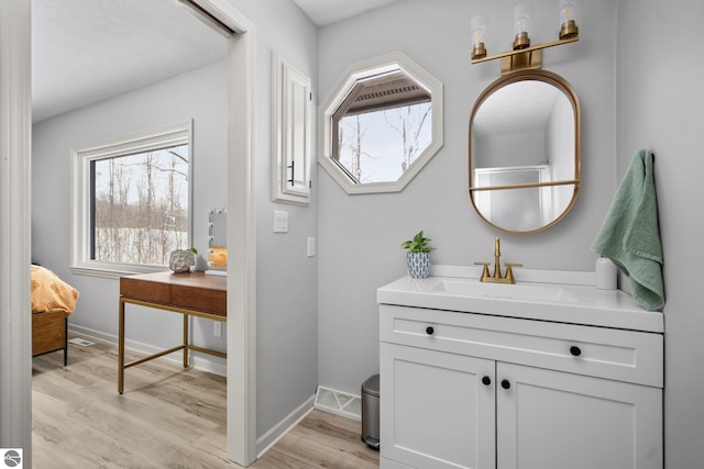 bathroom featuring vanity and hardwood / wood-style flooring