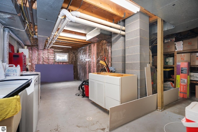 basement featuring washing machine and clothes dryer