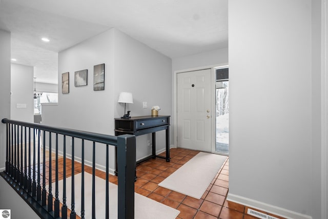 entryway with tile patterned floors