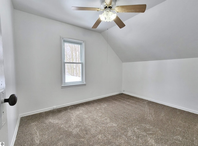 bonus room with a ceiling fan, baseboards, vaulted ceiling, and carpet flooring