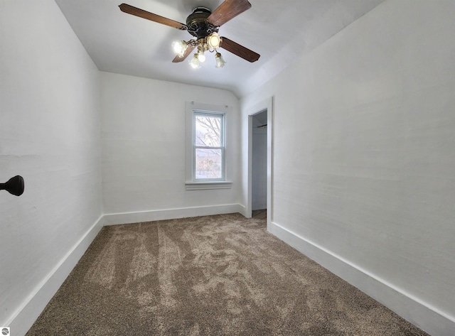 empty room with ceiling fan, carpet floors, and baseboards