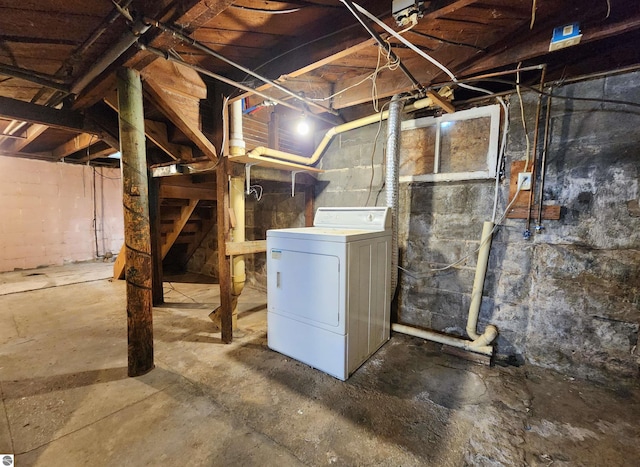 unfinished basement featuring washer / dryer