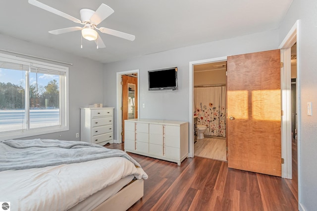 bedroom featuring dark wood-style floors, ceiling fan, and ensuite bathroom